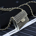 Chanel mini crossbody bag with blue ring-studded mesh and gold chain strap