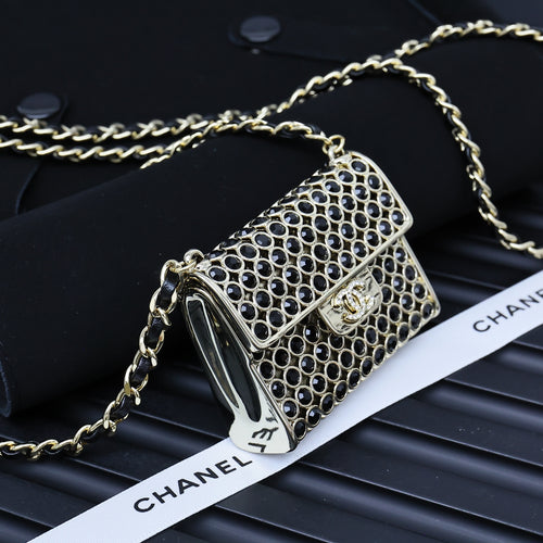 Chanel mini crossbody bag with blue ring-studded mesh and gold chain strap