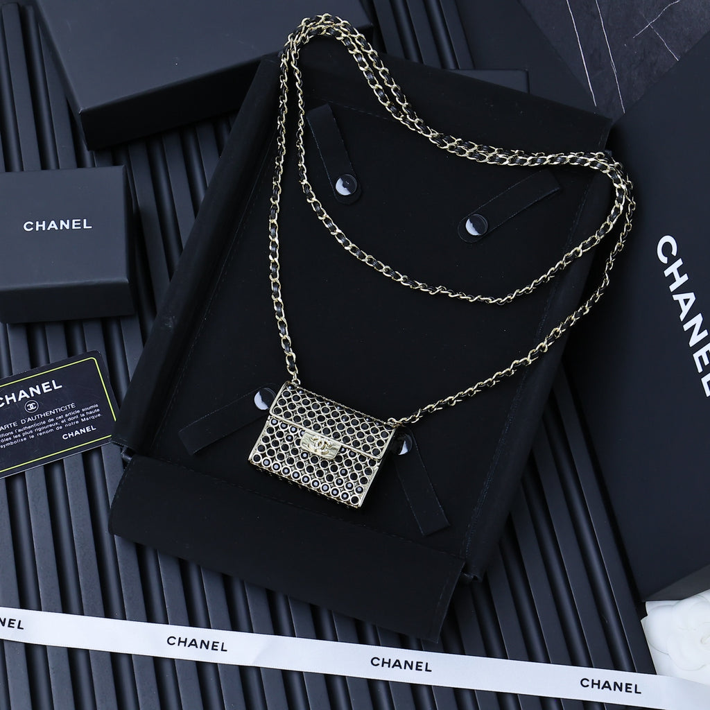 Chanel mini chain crossbody bag with silver ring-mesh flap and long gold chain