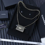 Chanel mini chain crossbody bag with silver ring-mesh flap and long gold chain