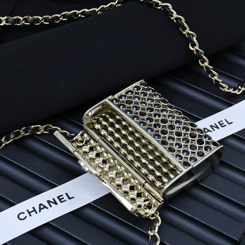 Chanel mini flap bag with textured gold back and blue ring-mesh front, chain strap