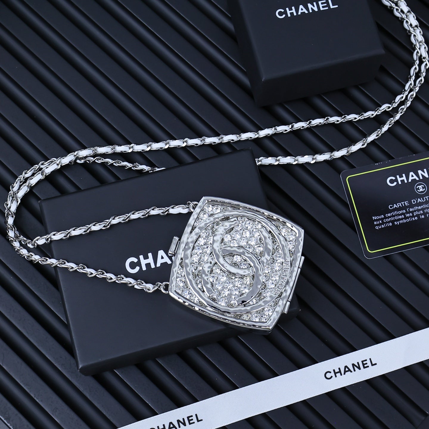 Silver-tone rhinestone square pendant necklace on link chain, centered view