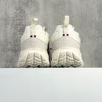 Moncler white sneaker heel view with back tab and textured outsole tread
