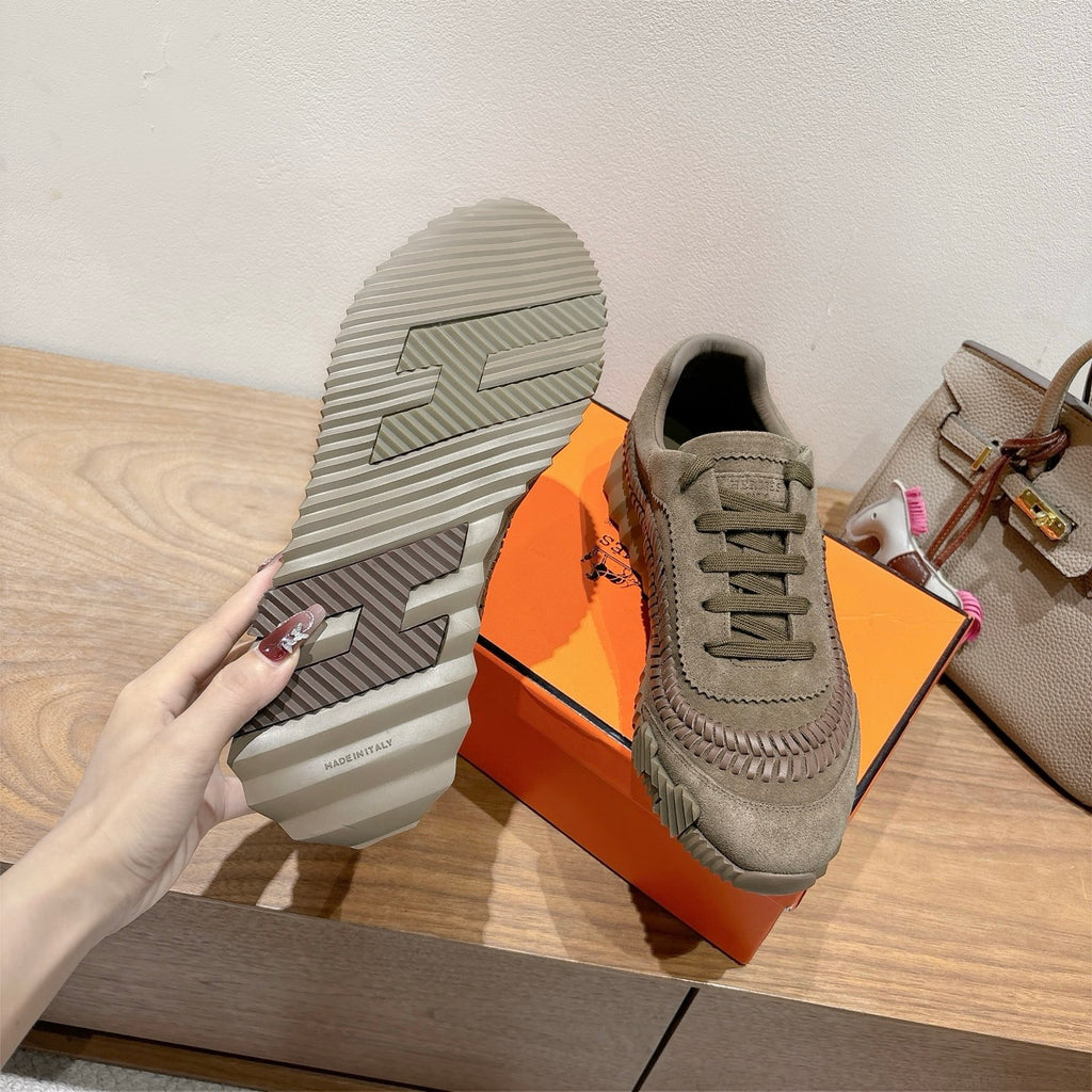 Olive suede sneaker with visible tread sole and lace-up upper