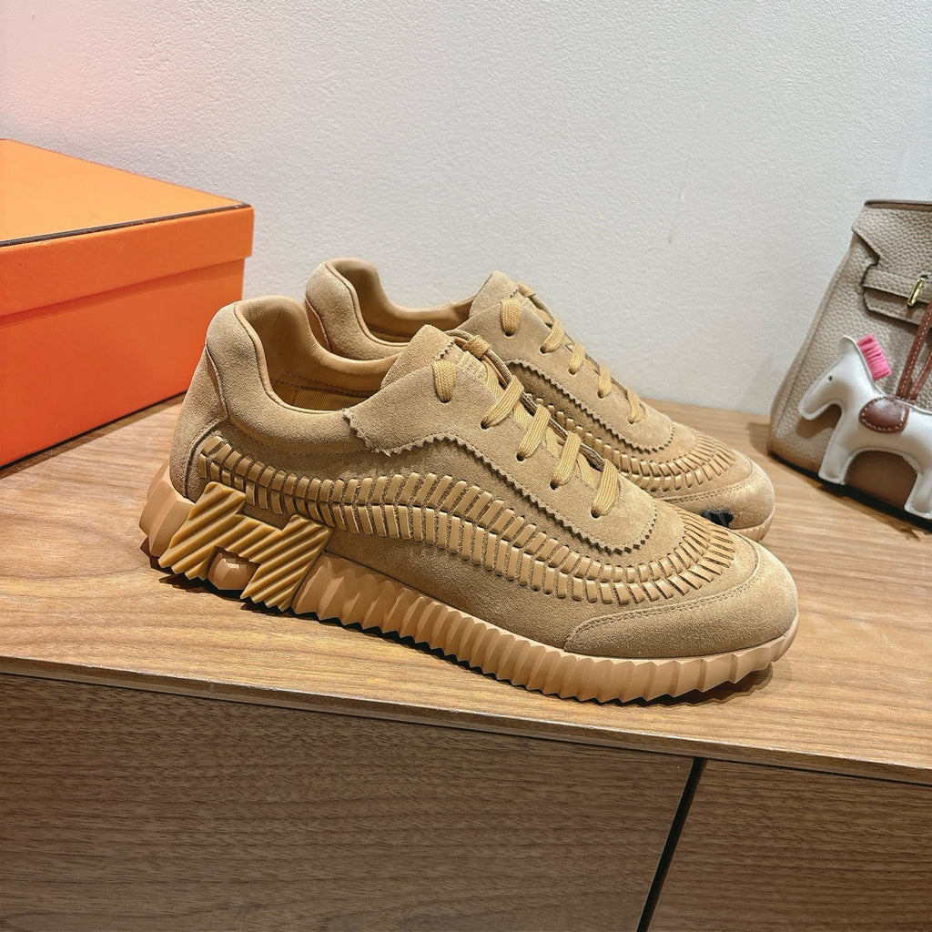 Beige Hermes unisex sneakers with lace-up, layered stitching, and chunky sole