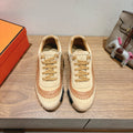 Unisex suede sneakers in beige with tan laces and orange stitched side panels