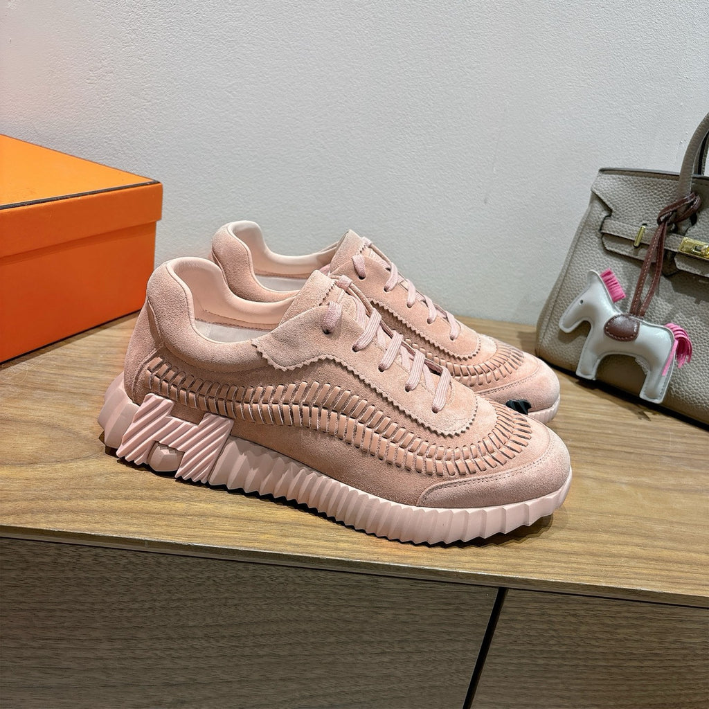 Hermes light pink lace-up sneakers with ribbed sole and stitched upper design