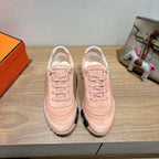 Hermes lace-up sneakers in light pink suede with textured sole and stitched detailing