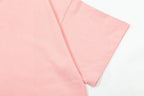 Pink short-sleeve T-shirt detail showing side seam and sleeve construction