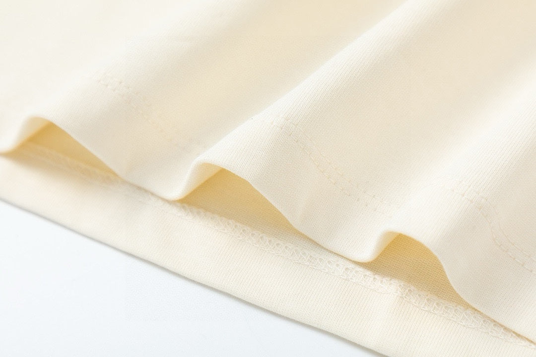 Gucci cream T-shirt lower hem with stitched edge
