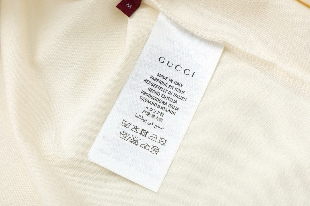 Gucci cream T-shirt care label at inside neckline