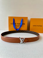 Louis Vuitton belt in brown leather with LV silver-tone buckle and curved strap.