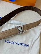 Beige monogram belt with silver-tone LV buckle and punched holes