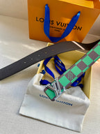 Louis Vuitton belt and silver LV buckle with green check strap in white pouch