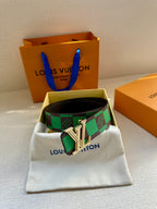 Louis Vuitton belt on white pouch with green check pattern and silver LV buckle