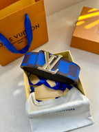 Louis Vuitton belt with blue and black checked strap and silver LV buckle