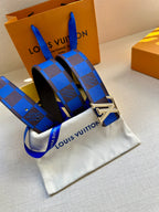 Louis Vuitton belt with blue and black checked strap and silver LV buckle