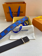 Louis Vuitton belt with blue and black checked strap and black leather tail