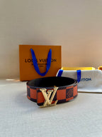 Checker-print belt with silver LV buckle and black leather backing