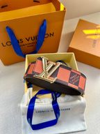 Orange and navy checker belt with silver buckle resting on white pouch