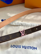Louis Vuitton belt close-up with pink LV buckle and monogram strap