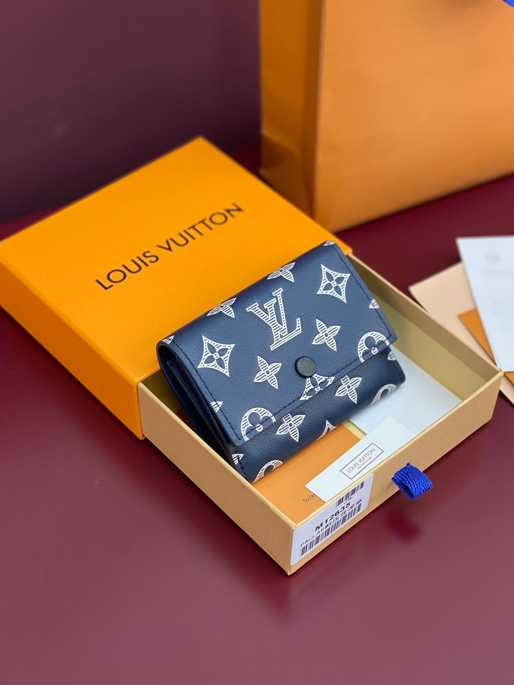 Blue small wallet with Louis Vuitton monogram print and flap