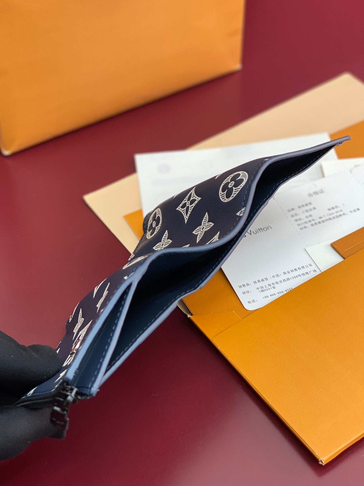 Blue Louis Vuitton monogram small wallet with zipper, open to bill area