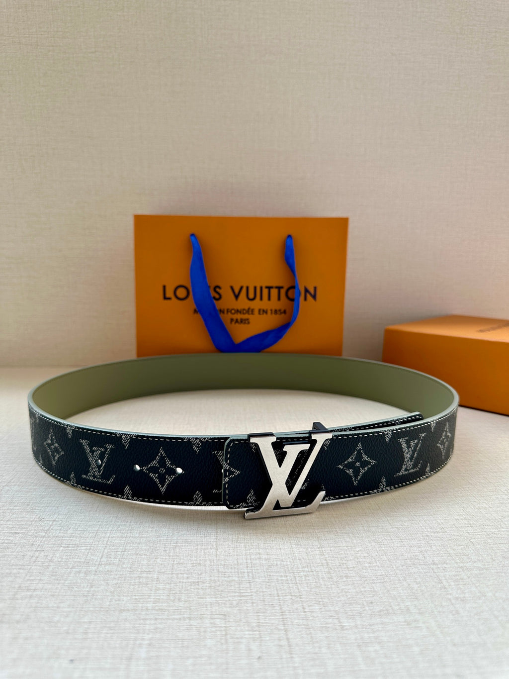 Louis Vuitton belt with navy monogram canvas and silver LV buckle