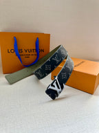 Louis Vuitton belt with navy monogram strap and silver-tone LV buckle