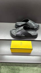 Fendi slide sandals with dark leather straps and open toe on thick platform sole
