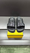 Fendi black slide sandals with logo strap and contoured footbed, pair view