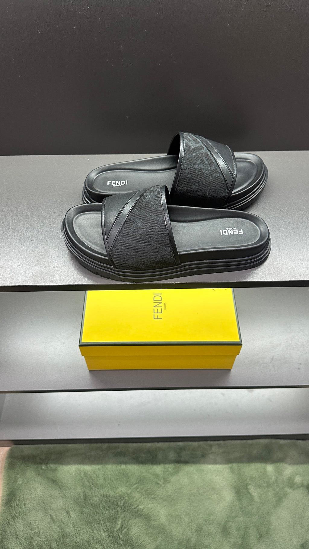 Fendi slide sandals with dark cross strap and layered platform sole