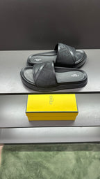 Fendi slide sandals with dark cross strap and layered platform sole