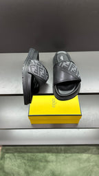 Dark slide sandals with FF logo strap and raised sculpted sole