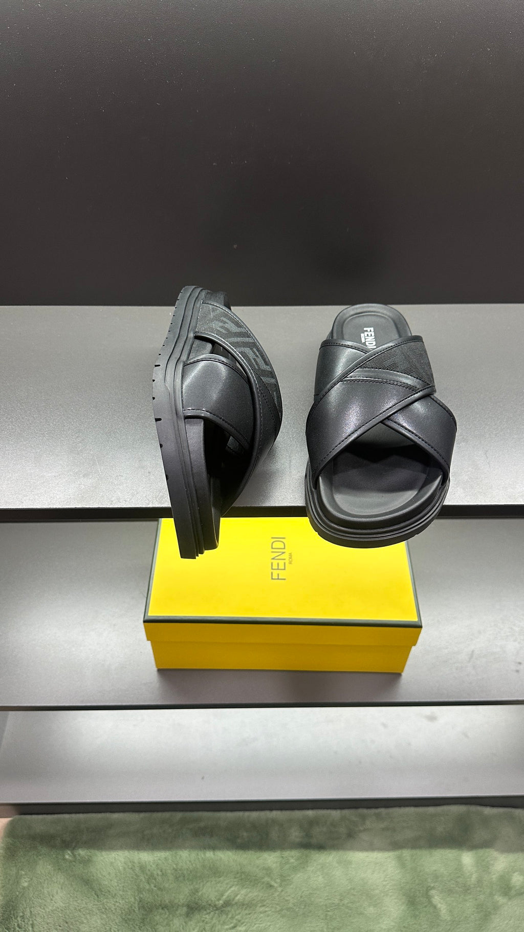 Fendi black slide sandals with logo strap and chunky sole