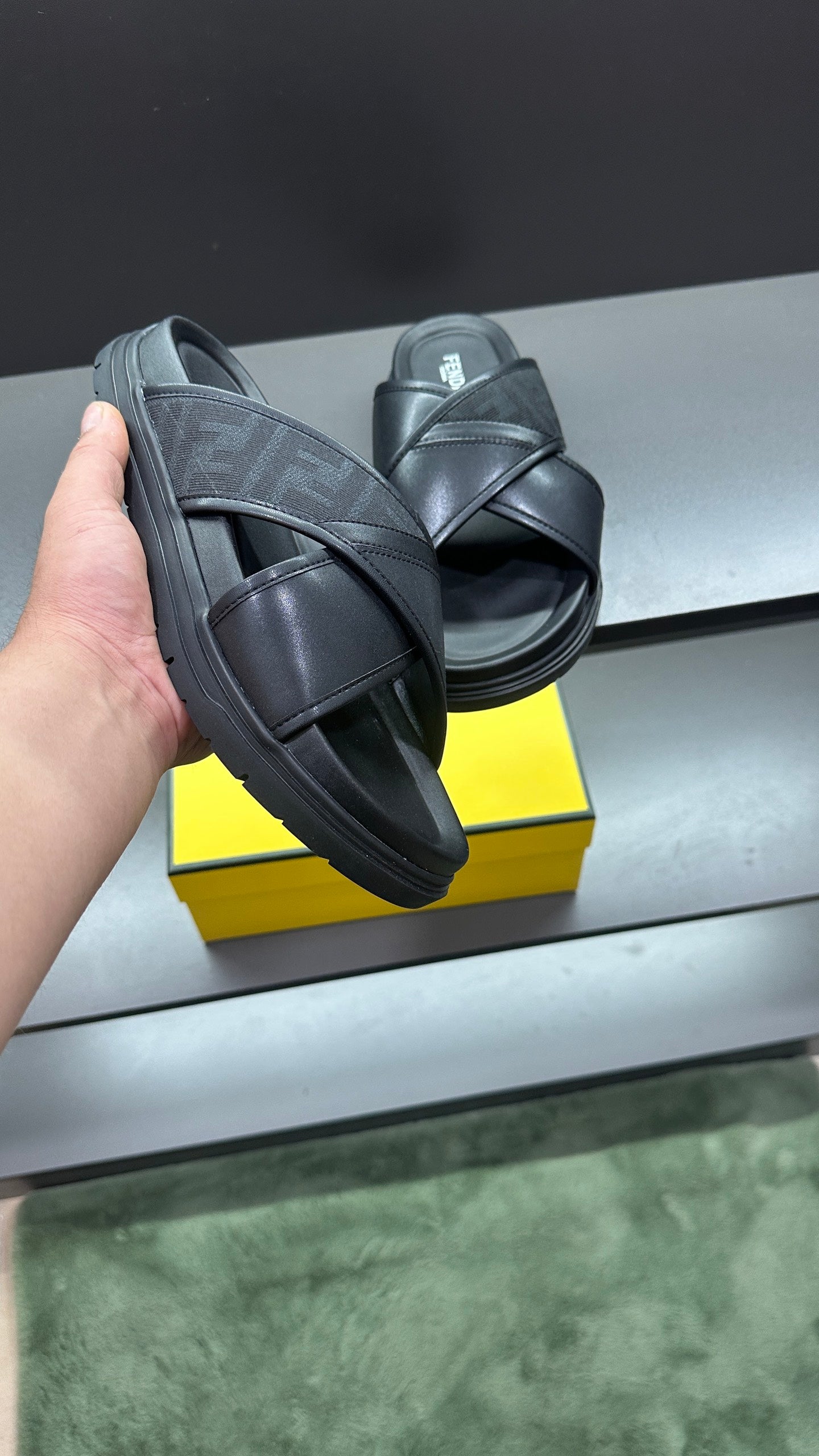 Fendi black slide sandals with thick sole and wide leather straps