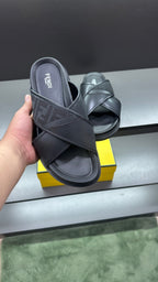 Fendi black slide sandals with FF logo strap and wide crossover