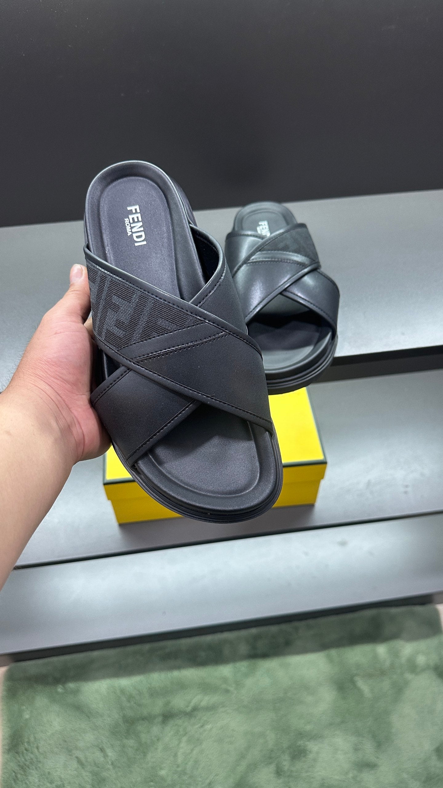 Fendi black slide sandals with FF logo strap and wide crossover