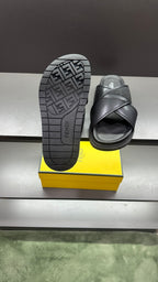 Fendi black slide sandals showing textured FF outsole pattern