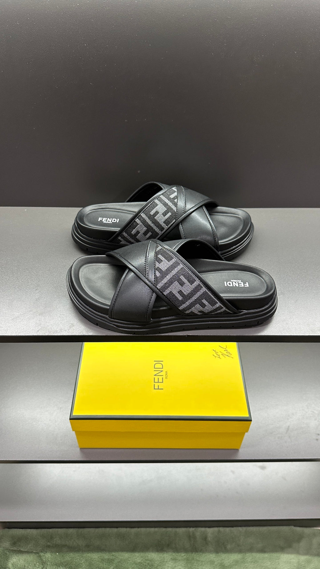 Fendi leather slide sandals with FF monogram strap, black, side view