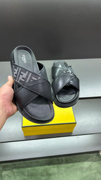 Fendi leather sandals with FF logo straps, black, shown from heel side