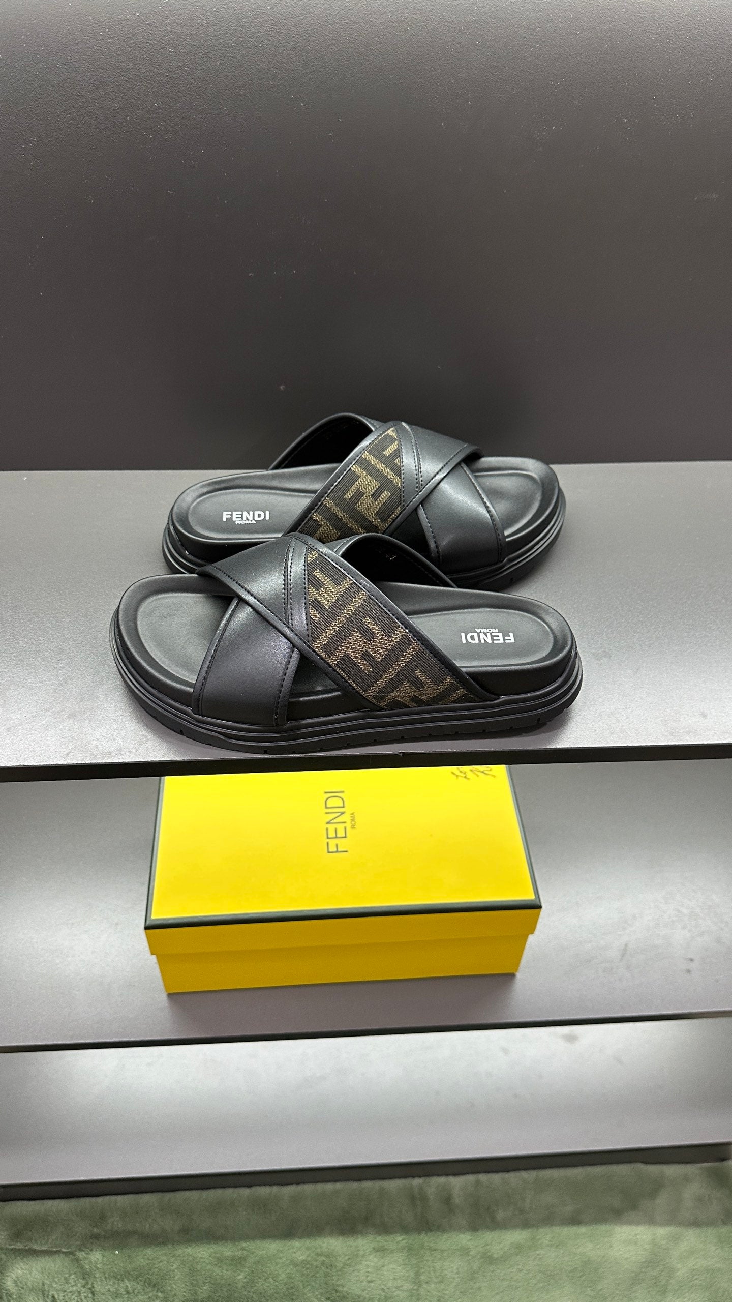 Fendi black slide sandals with FF logo strap and cushioned footbed