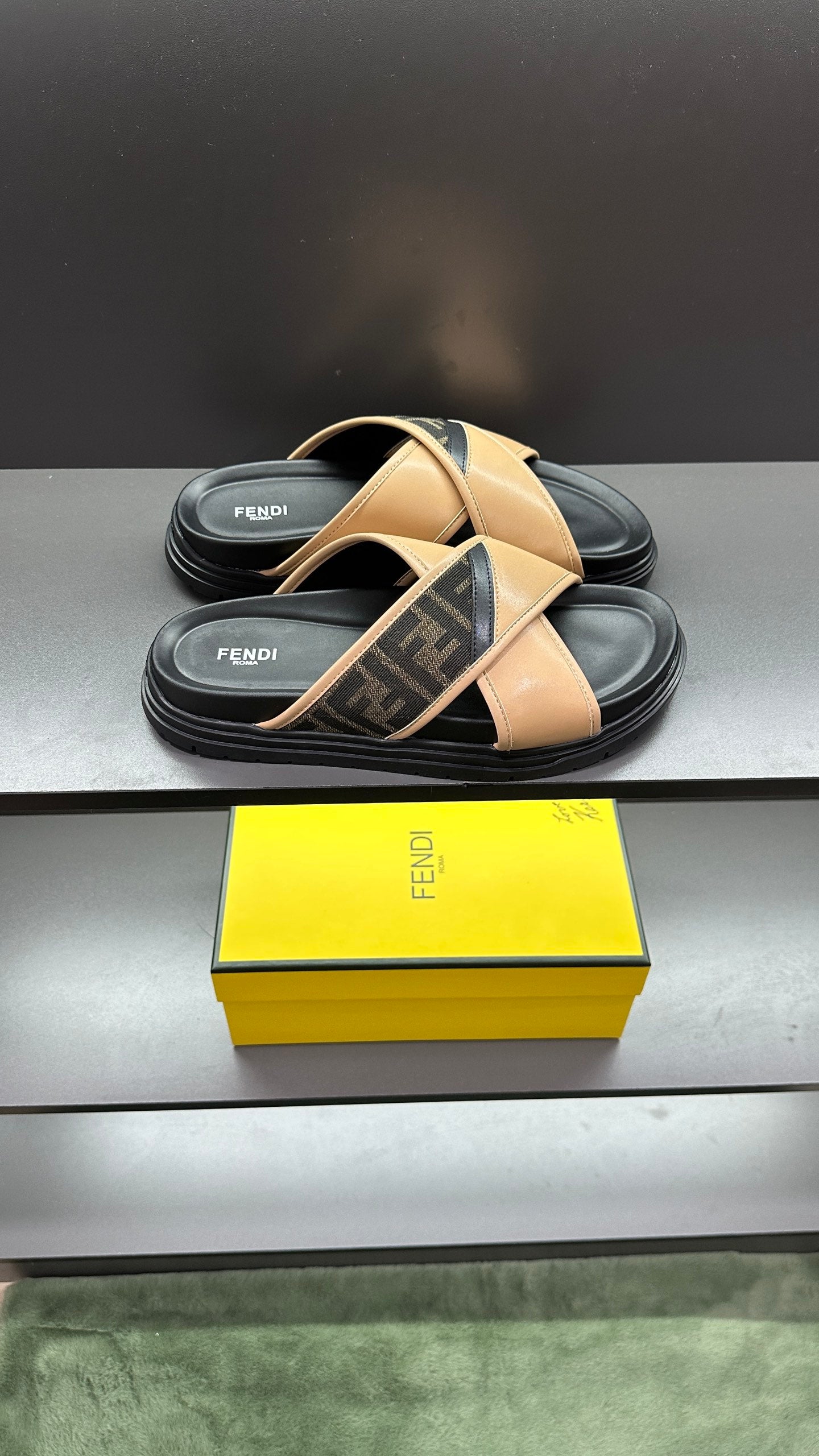 Fendi slide sandals, beige cross straps with dark logo band and black cushioned sole