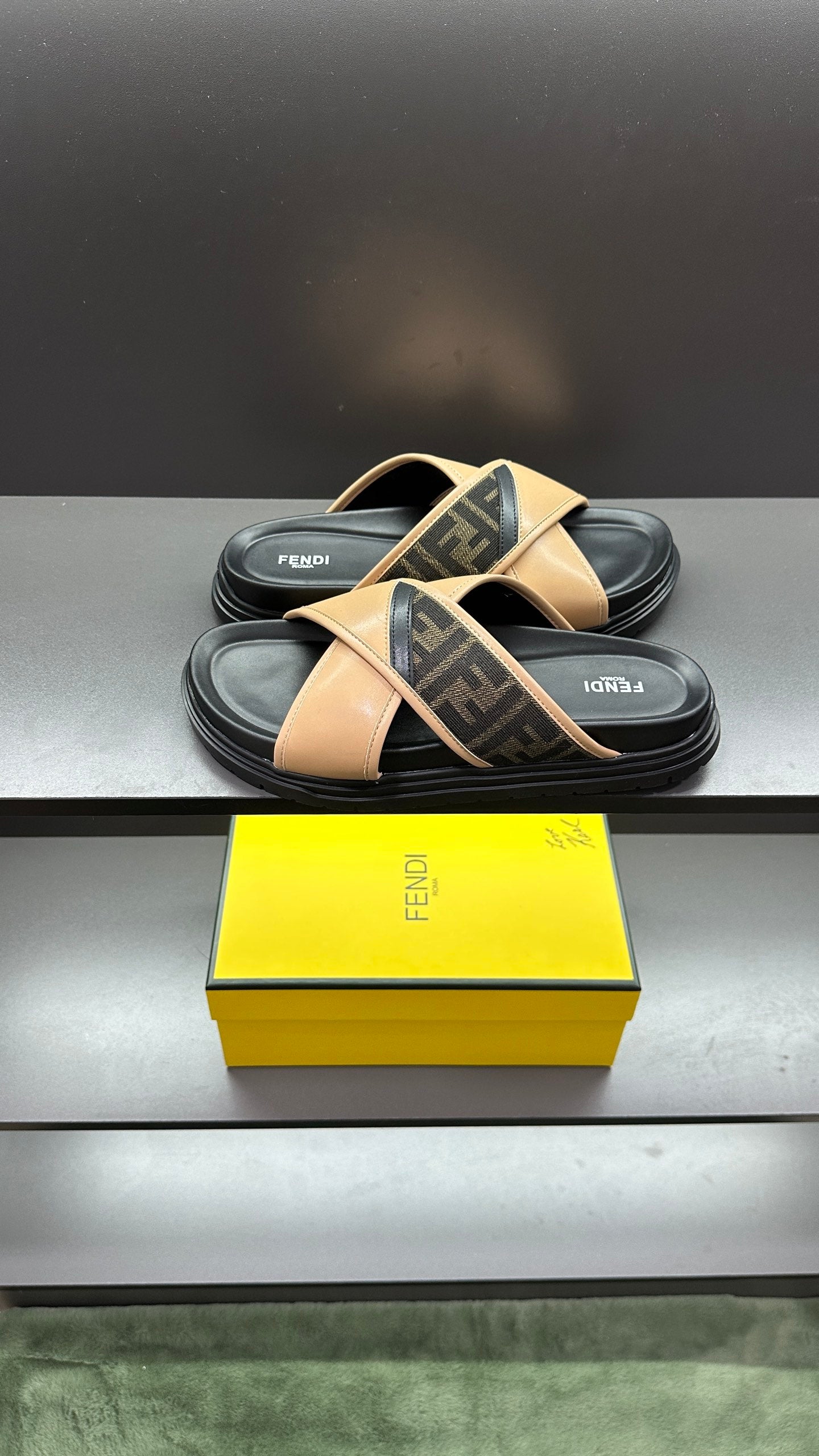 Fendi slide sandals showing beige straps over dark footbed, black platform sole