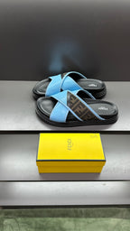 Fendi blue sandals with cross-strap design and dark rubber sole, paired view