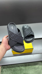 Fendi slide sandal in dark color with FF logo strap and open toe on thick sole