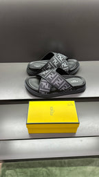 Fendi FF logo slide sandals with dark gray straps over chunky dark footbeds