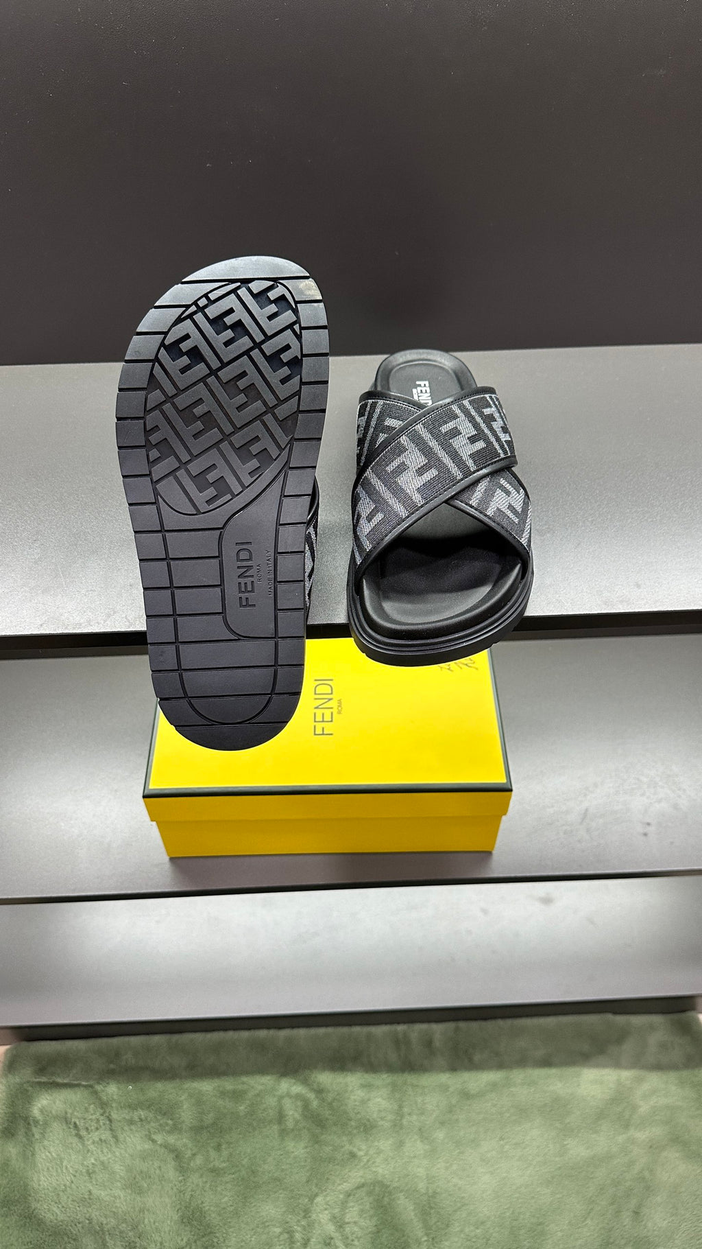Fendi FF logo slide sandals with dark gray upper and dark outsole with grid tread