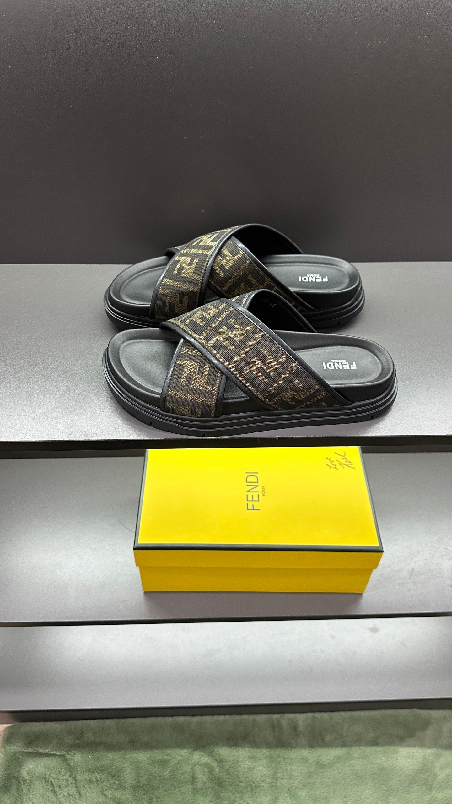 Fendi slide sandals with FF logo straps and dark cushioned footbed