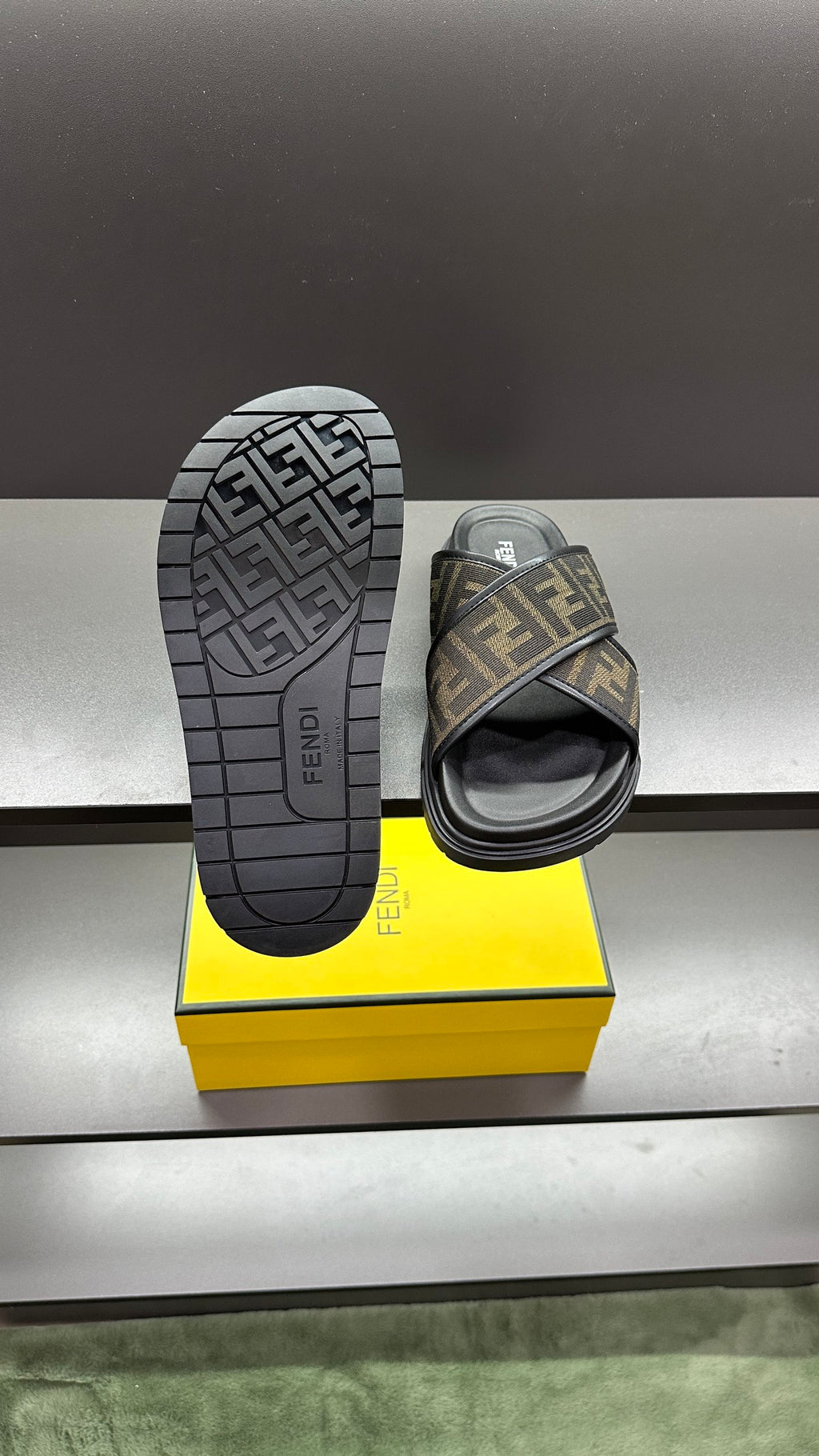 Fendi slide sandals outsole view, tread pattern with FF logo branding